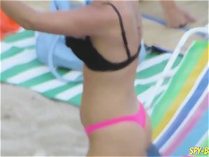 pink bikini first-timer stripped to the waist hidden cam Beach women