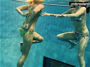 two handsome amateurs demonstrating their bodies off under water